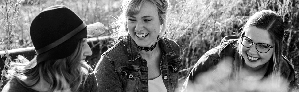Young women laugh together