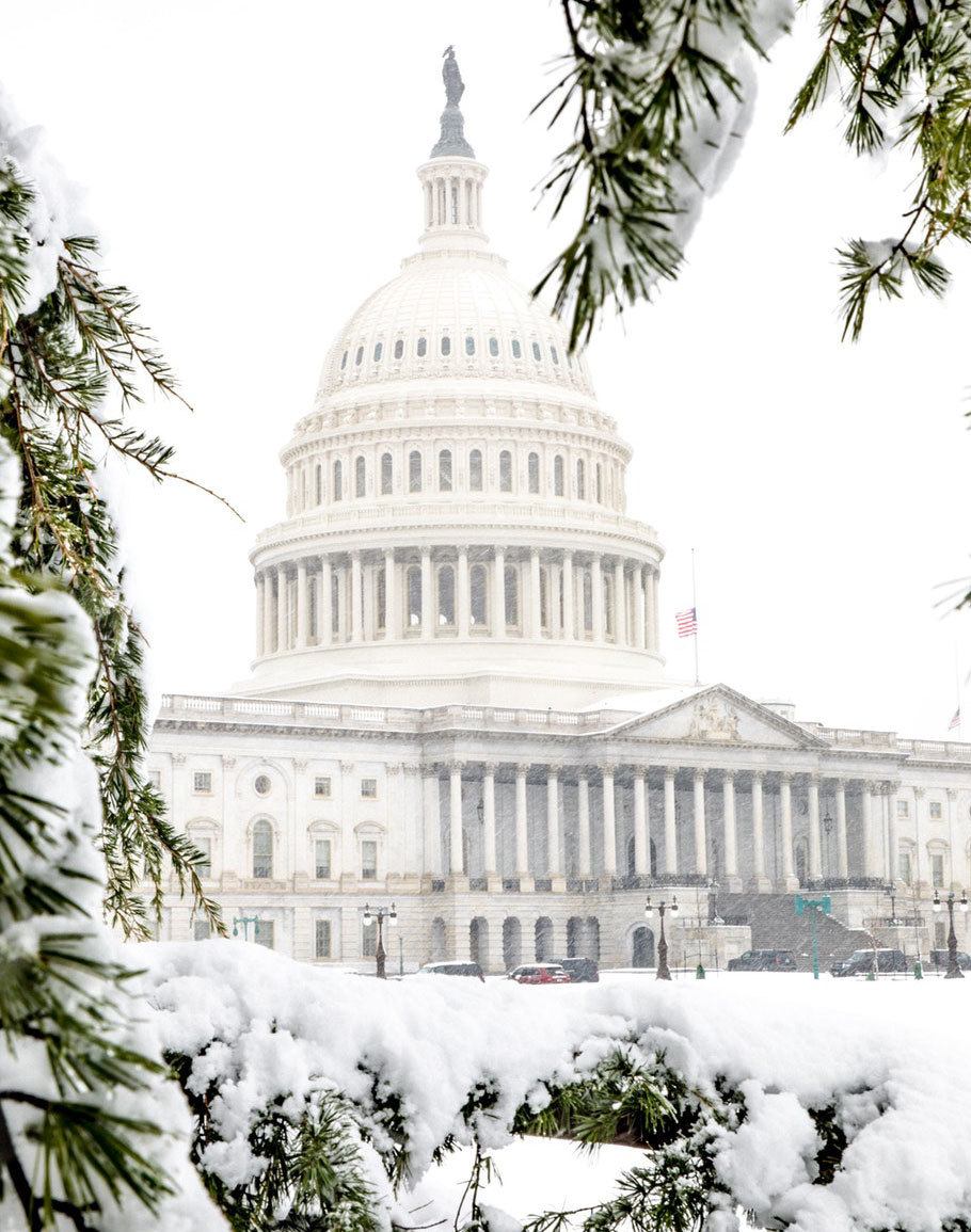 The Capitol building is covered in snow